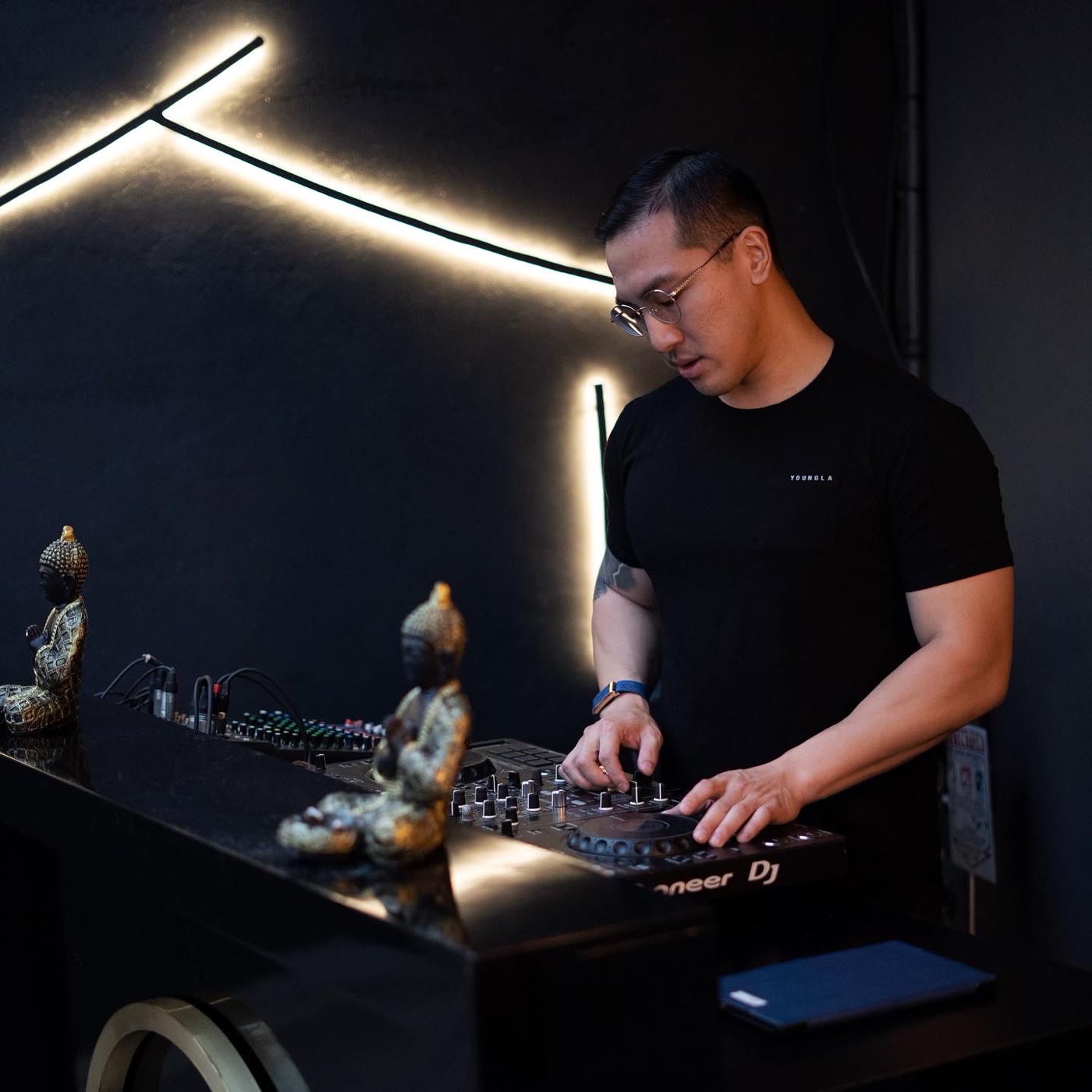 DJ behind the decks at a night event